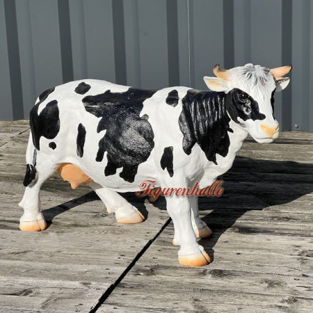 Schwarz bunte Kuh Werbefigur Käse