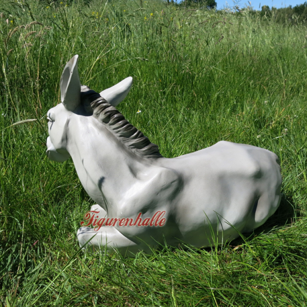 Donkey garden figure in gray lying