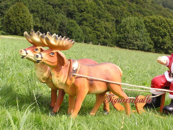 Christmas decoration Father Christmas and Sante on a sleigh