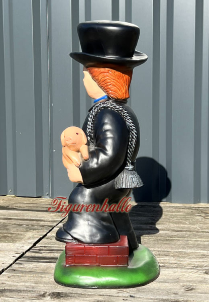New Year's Eve chimney sweep statue with ladder