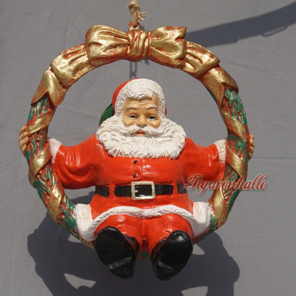 Winter Father Christmas in a wreath figurine