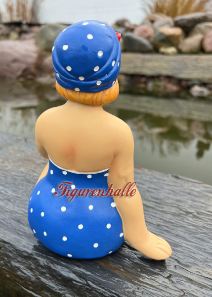 Woman with swimsuit and retro bathing cap in blue white figure